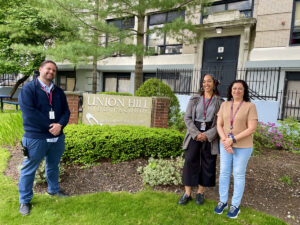 Teachers from Union Hill Middle School in front of their school.